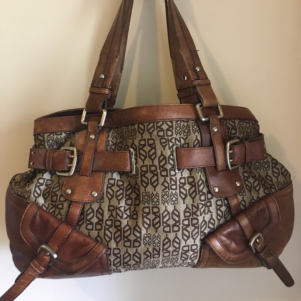 Vintage DKNY satchel bag w/real leather trim, straps and accent.